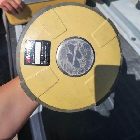 An overtop image of a yellow circular device.