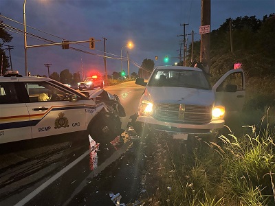 Photo of crashed truck and police car