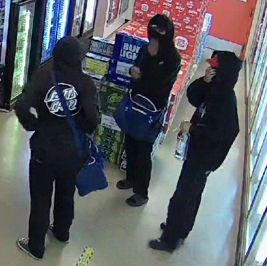 Three suspects wearing black clothing and face coverings