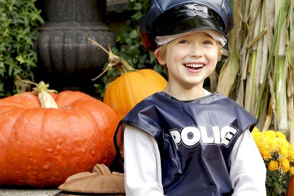 Photo of child dressed as a police officer for halloween