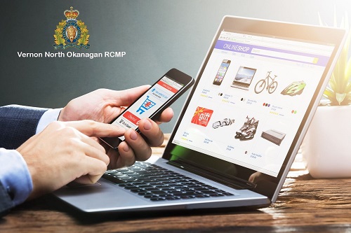 photo of person using phone and computer