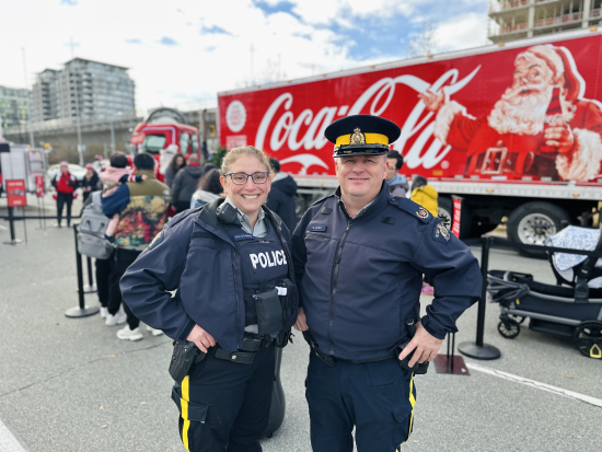 RCMP officers standing beside each other smiling
