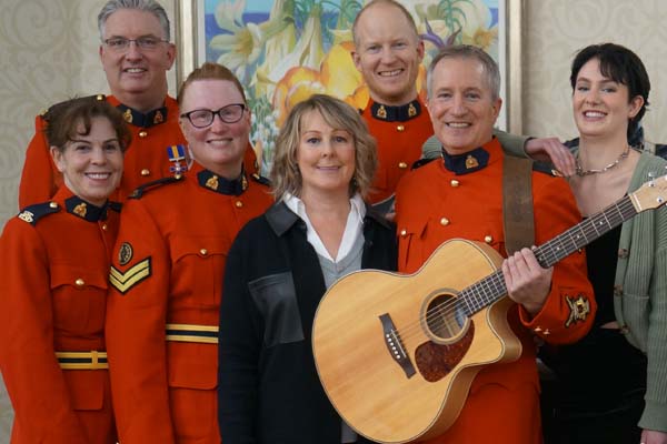 Photo of the Christmas Cheer Crew performing a Christmas carol