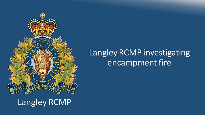 Photo of banner stating Langley RCMP investigating encampment fire