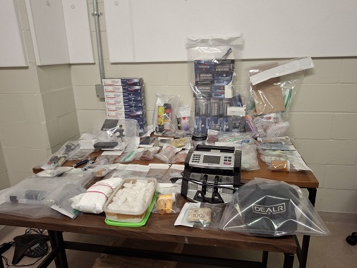 Suspect illicit drugs, paraphernalia and money