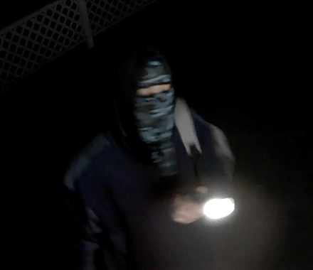 Person with a flashlight