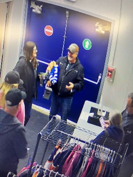 The man is described as approximately 50-year-old, Caucasian, heavy build, with gray hair and a mustache, and wearing a gray cap, black jacket, and blue jeans