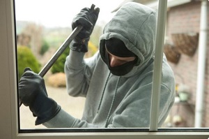 Criminal breaking into house 