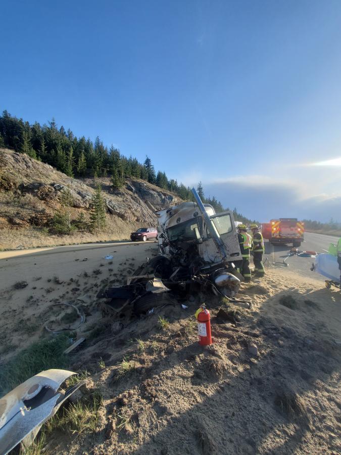 Semi tractor in the center median of the Coquihalla Highway with significant front end damage,