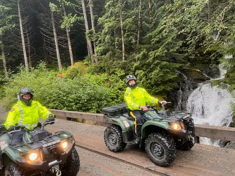 Police officers safely operating ATVs