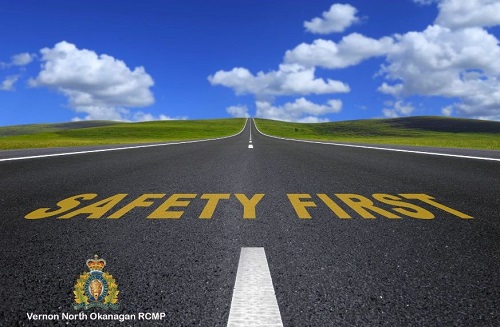 stock image of blue sky and road with saafety first in yellow letters