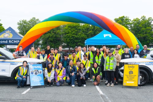 Richmond RCMP officers, volunteers, and partner agencies standing together