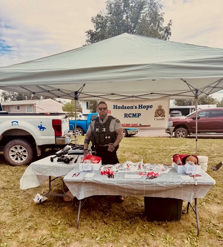 RCMP member and information booth 