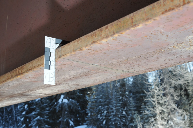 Photo under Lamprey Creek Bridge with cut across support beam