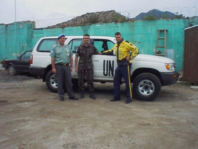 Photo of Inspector Maure in front of a UN vehicle.
