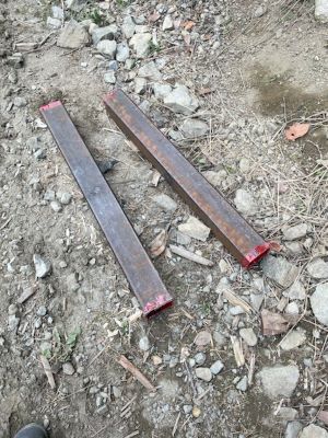 Photo of two steel re-bar.