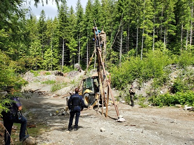 unstable tripod with person being removed by ERT officer