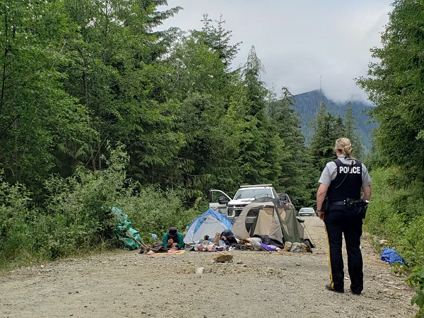 Individuals in locking devices on the ground