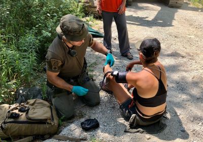 Photo of an individual receiving medical assistance.