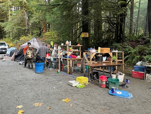 Photo of kitchen area with shelves and tables