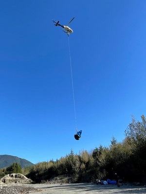RCMP Helicopter air lifting items out of the area