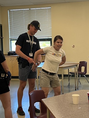Cst Sherri Wade being arrested during scenario-based training