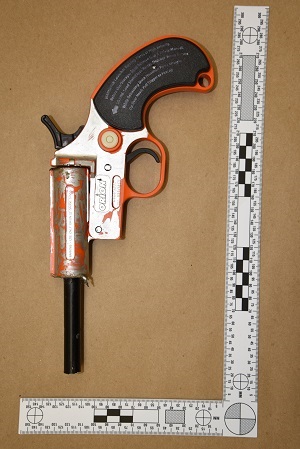 Flare gun converted to firing 22 calibre bullets