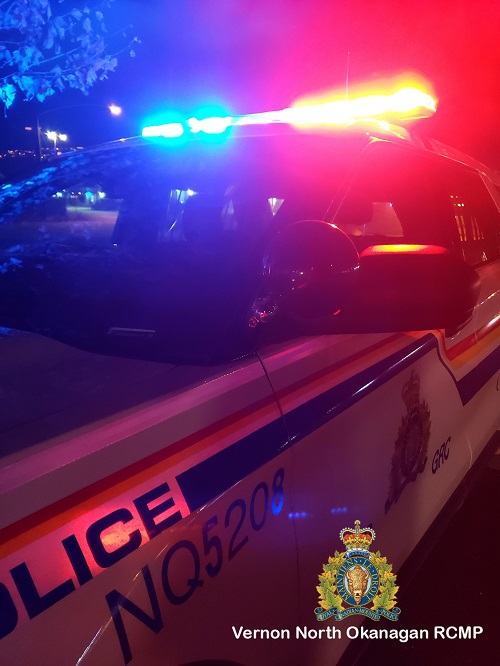 stock photo of police vehicle with flashing red and blue lights