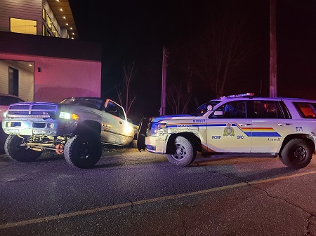 Photo of white Dodge Ram in ditch